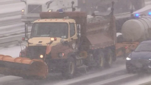 Heavy traffic driving in snow storm and blizzard on busy highway Stock Footage 72424093