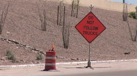 Heavy Traffic in Foreground; "Do Not Follow Trucks" Road Sign In the Background Video stock 18974724