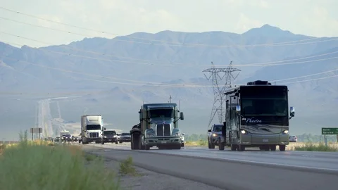 Heavy traffic on Interstate freeway 15. Cars and trucks on the road California  Stock Footage 86156299