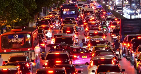 Heavy traffic jam on busy crowded street in Bangkok at night Stock Footage 326388257