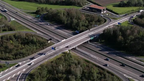 Heavy traffic on swiss highway intersection with motorway bridge, aerial orbit Stock Footage 164412310