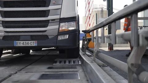 Heavy Truck Positioned on Inspection Platform at Logistics Facility Stock Footage 336777385