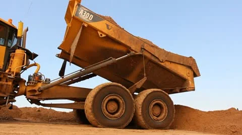 Heavy vehicles Heavy mining soil loader road vehicles truck digging Asphalt Stock Footage 10717563