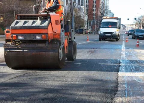 Heavy Vibration roller compactor at asphalt pavement works for road repairing Stock Photos