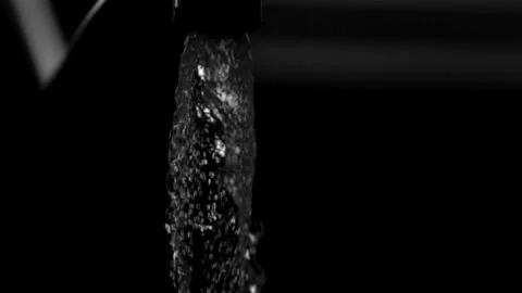 Heavy water stream flows against black background. Stock Footage 326629787