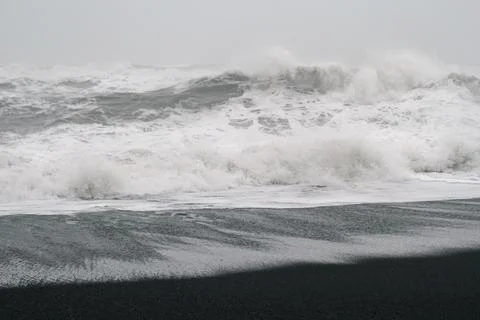 Heavy waves rolling on beach monochrome landscape photo Фото