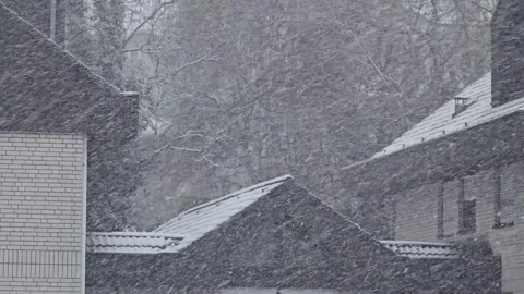 Heavy winter snowfall over rooftops Stock Footage 347827184
