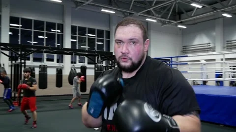 Heavyweight boxer boxing in the camera. Stock Footage 166730610