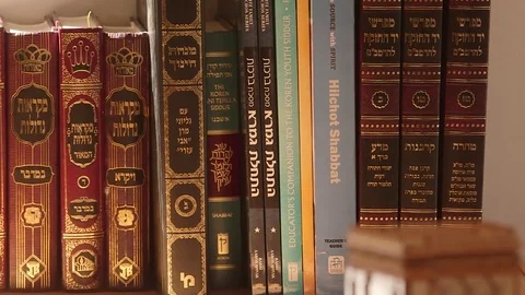 Hebrew books on shelf Video stock 77045171