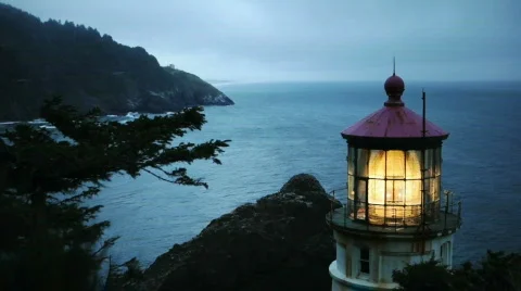 Heceta Head Lighthouse on Oregon Coast at Dusk Stock Footage