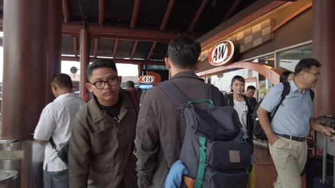 Hectic Passenger at Drop Off Zone Terminal 2 Soekarno Hatta Airport Stock Footage 129888014