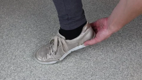 Heel falling of worn down sneakers, broken shoes  Stock Footage 287131290