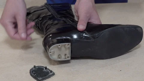 Heel is removed from boots Video stock 309874648