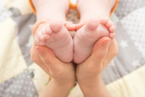 Heels of an infant, a child Stock Photos