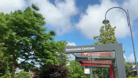 Heemstede centrum sign on the bus stop against blue sky. It is a town and a Stock Footage 280230731