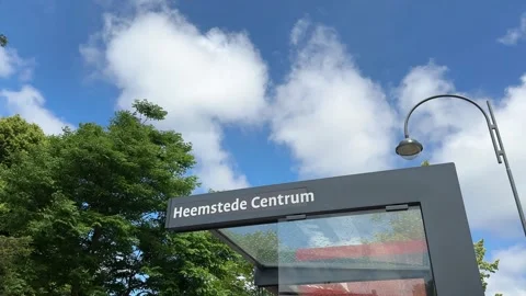 Heemstede centrum sign on the bus stop against blue sky. Heemstede is a town and Stock-Footage 280230763