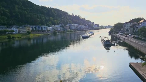 Heidelberg, Germany Neckar River view with tour boat, rowing team, riverside Stock Footage 335989957
