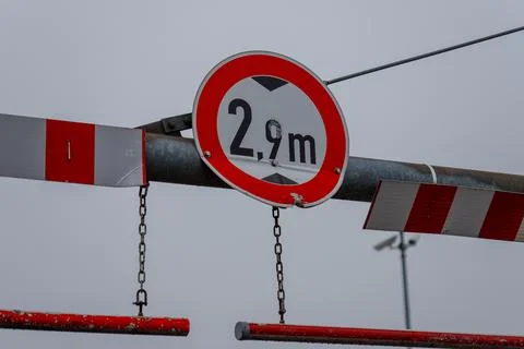 Height restriction sign warning vehicles on barrier Stock Photos
