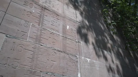 Height Scale Engraved Into an Old Canal Rock Wall Stock Footage 75700662