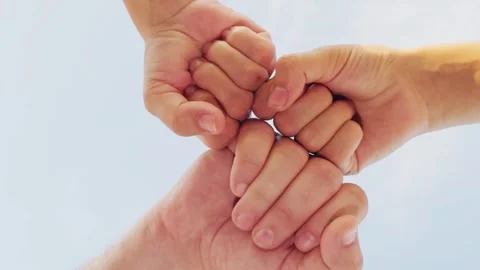 Held hands circle, forming bond. woman man hands joined together, symbolizing Stock Footage 287425432