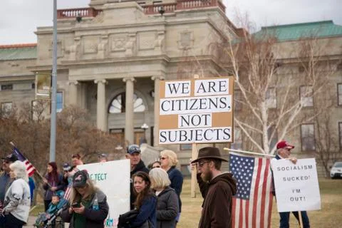 Helena, Montana - April 19, 2020: Protestor holding sign against shutdown Stock Photos