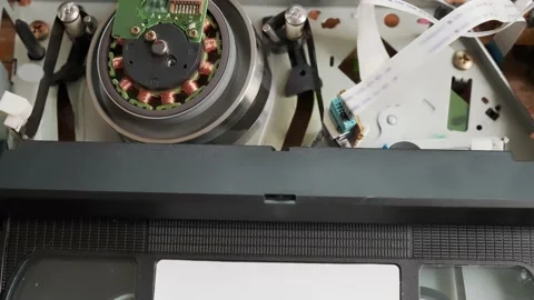 Helical wrap of tape around VHS head drum. Inside view VCR Stock Footage 218998985