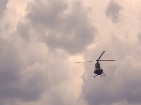 Helicopter above the field Stock Footage 76649194