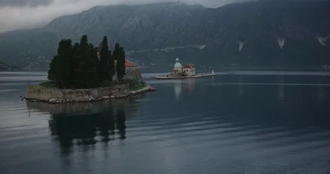 Helicopter aerial over two small islands in Montenegro, foggy day Stock-Footage 103976533