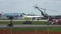 Helicopter And Historic Ford Trimotor Plane Take Off At Airshow HD Footage