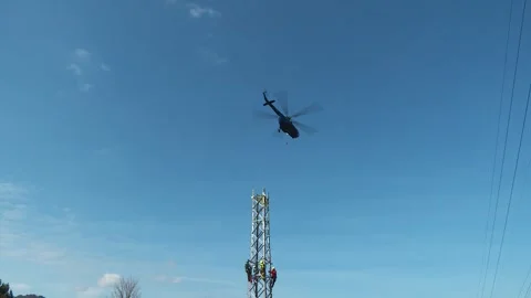 Helicopter Approaching Transmission Tower Construction Site Stock-Footage 346233743