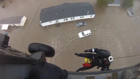 Helicopter Aquatic Rescue Team perform flood rescue operations - 2015 Stock Footage