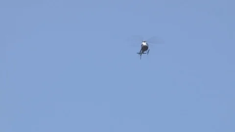 Helicopter in Blue Sky Stock Footage 72978000