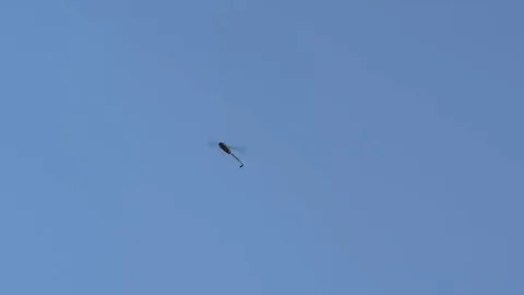 Helicopter in blue sky Stock Footage 77415178