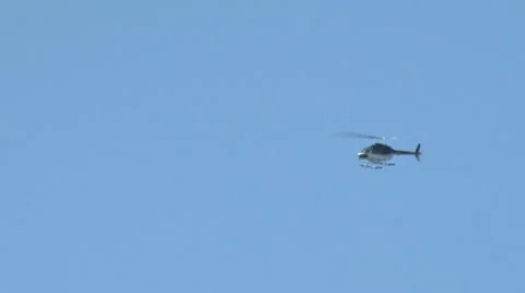 Helicopter in Blue Sky right to left Stock Footage 8537511