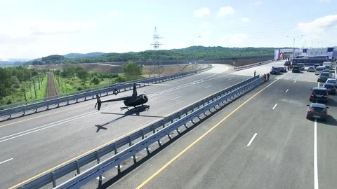 A helicopter boarded a road Stock Footage 141437780