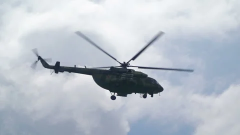 Helicopter bomber for attack slow mo. Skill for fly in blue cloudy sky and perfo Stock Footage 199488547