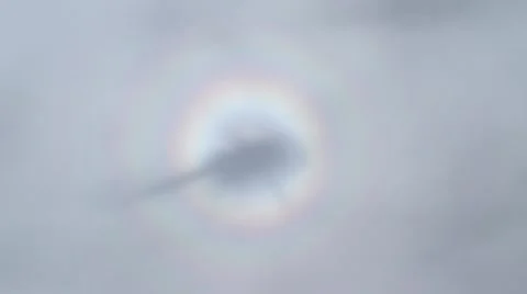 Helicopter circle rainbow reflection in the clouds Stock Footage 54603351