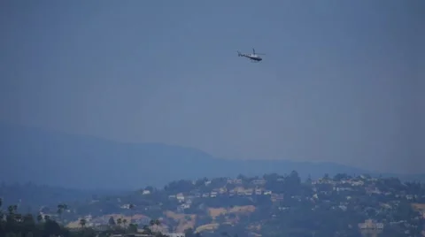 Helicopter circling around above Hollywood Hills in Los Angeles, California. Stock Footage