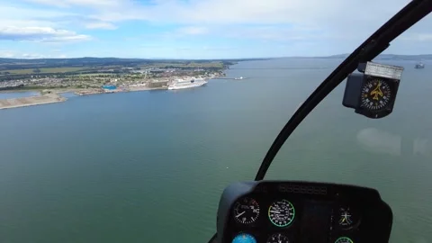 Helicopter cockpit view flying towards cruiseship parked at port harbor Stock-Footage 274741103