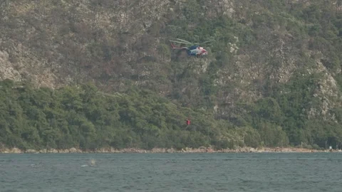 Helicopter Collecting Water for Firefighting Stock Footage 282929376