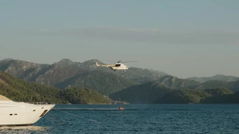 Helicopter Collecting Water for Wildfire Response Stock Footage 282929428