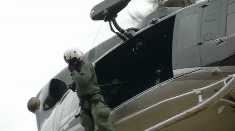 Helicopter Crew Chief Observes from Hover (HD) Stock Footage 644013