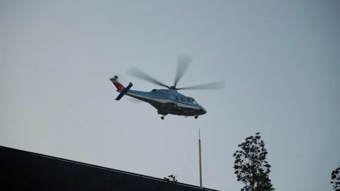 A helicopter is currently flying overhead, showcasing an aerial adventure and Stock Footage 293318916