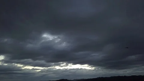 HELICOPTER ON A DARK AND CLOUDY DAY (SUPER WIDE) Stock Footage 98462840