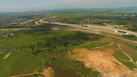 Helicopter ( drone, quadcopter ) flies above fields, road with cars Stock Footage 92201489