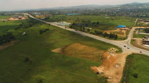 Helicopter ( drone, quadcopter ) flies above fields, road with cars Stock Footage 92201534