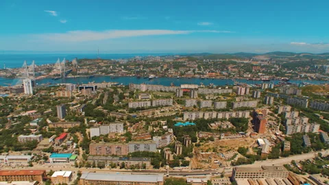Helicopter ( drone, quadcopter ) flies over the city, the sea, houses  Stock Footage 92200666