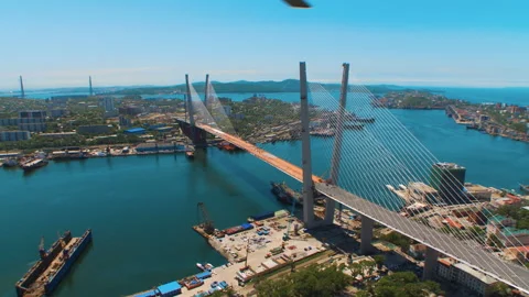 Helicopter ( drone, quadcopter ) flies over the coastal city, the sea, houses  Stock Footage 92200856