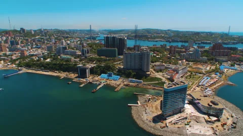 Helicopter ( drone, quadcopter ) flies over the city, the sea, houses  Stock Footage 92200943