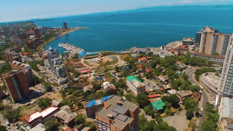 Helicopter ( drone, quadcopter ) flies over the city, the sea, houses Stock Footage 92200997